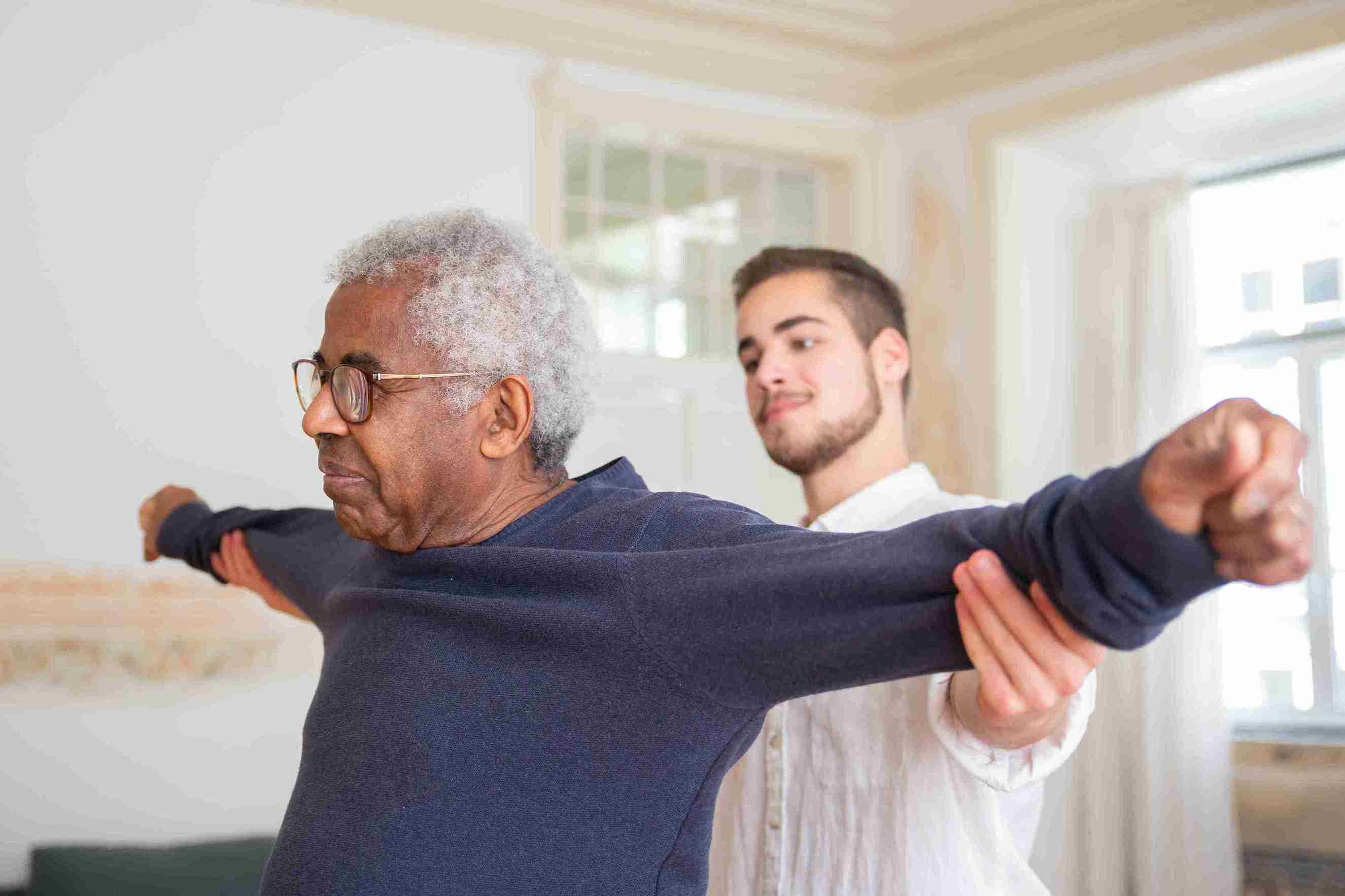 a man helping an old man