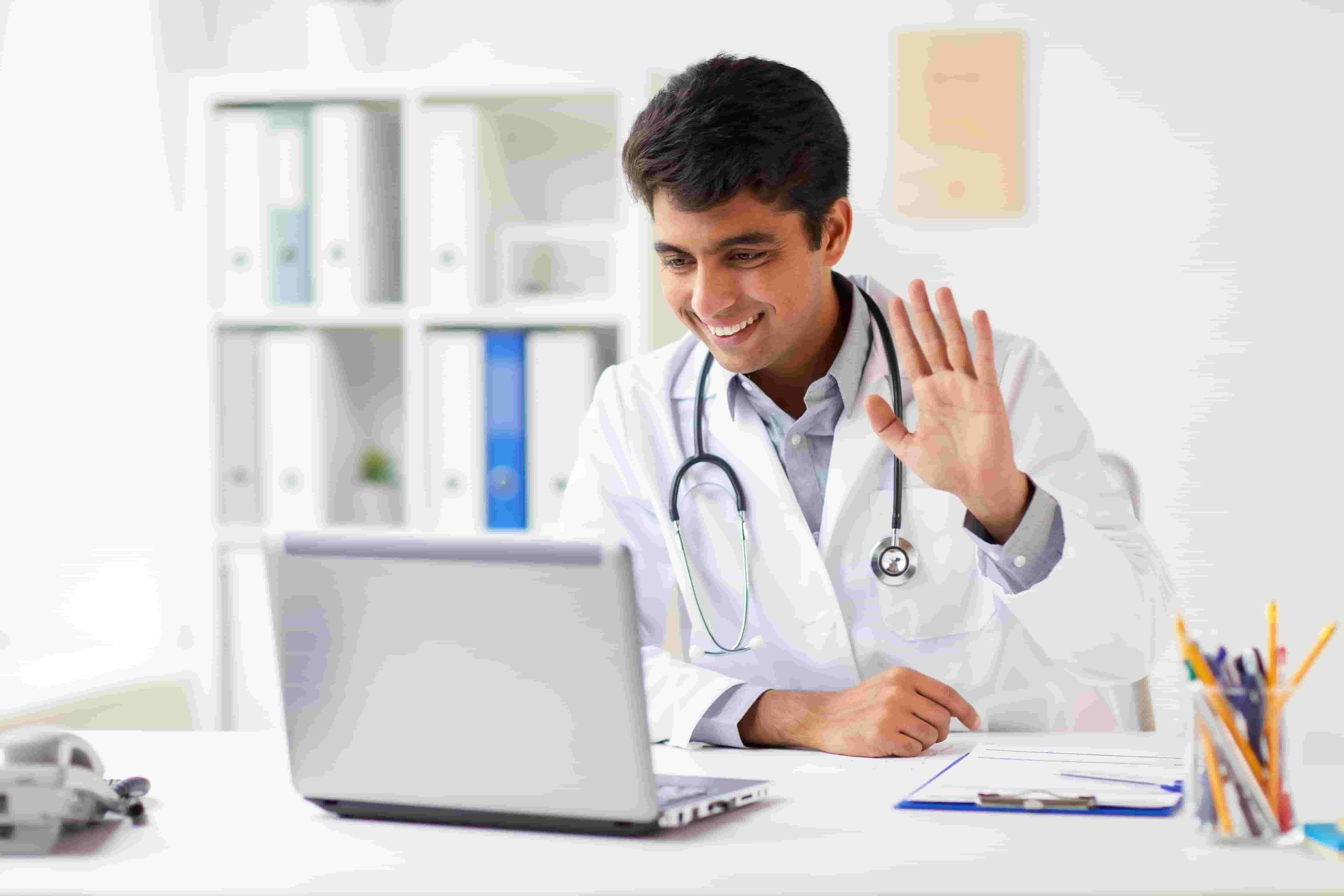 Doctor waving on a video call