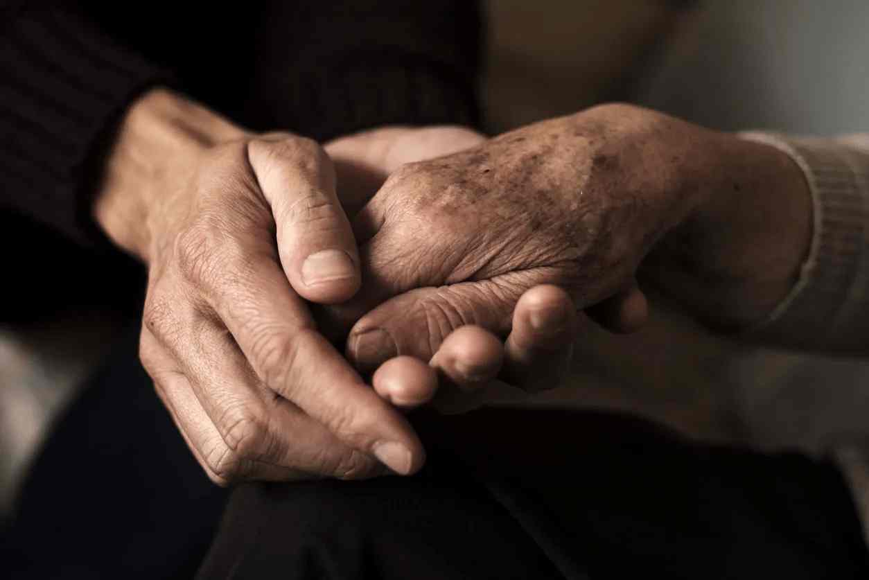 Hands of elderly parents